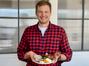 Man in Red Plaid Shirt Holding Mini Charcuterie