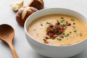 Beer Cheese Soup Sprinkled with Bacon and Chives