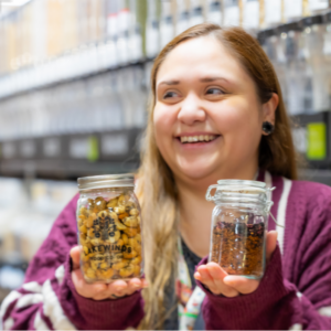 Employee Angel Holding Jars With Bulk Products