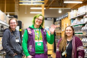 Three Bulk Employees Standing in the Bulk Aisle